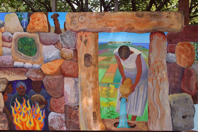 Acrylic mural of woman pouring water, by Jenny Badger Sultan's family. Click to enlarge